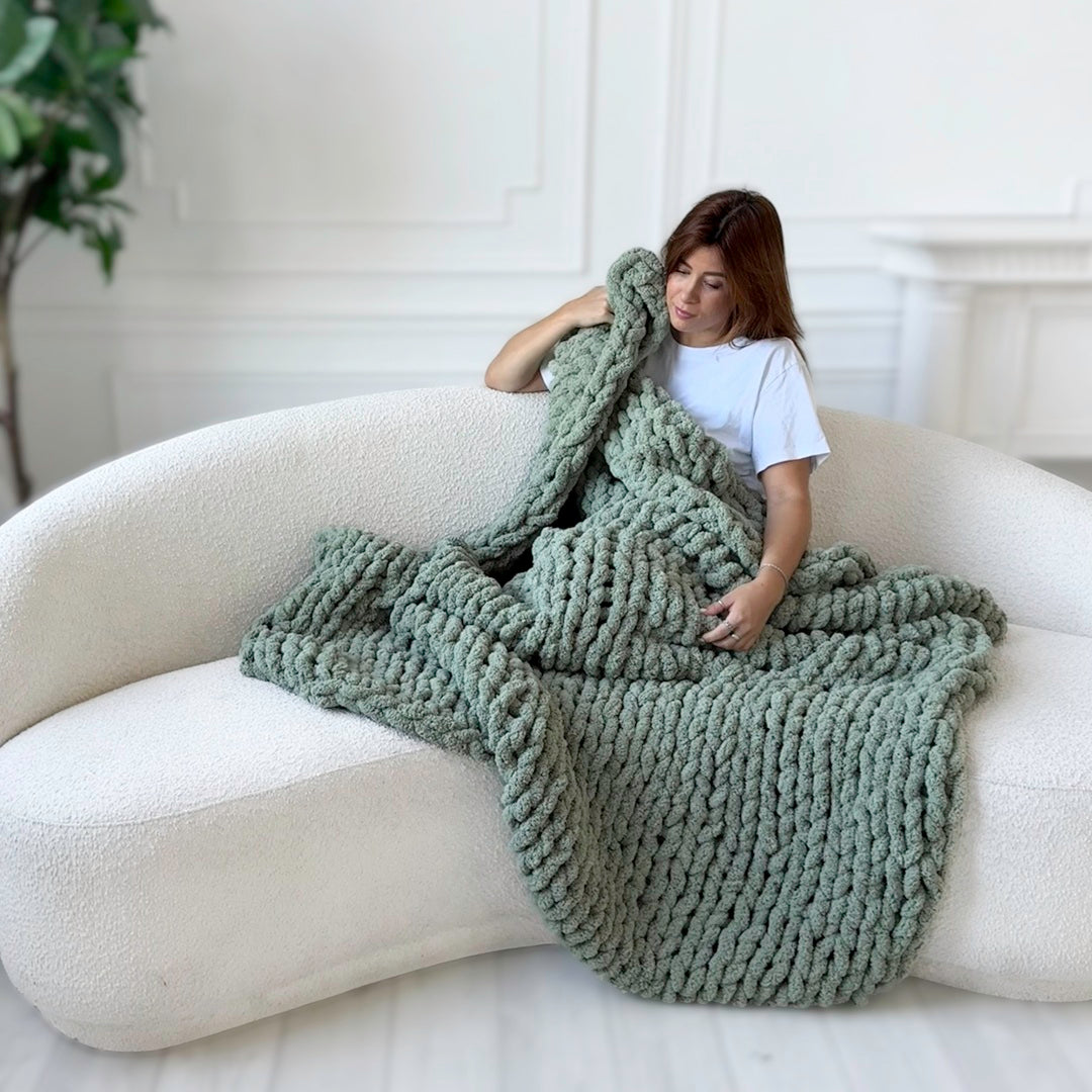 Chunky knit throw blanket adding warmth to sofa décor